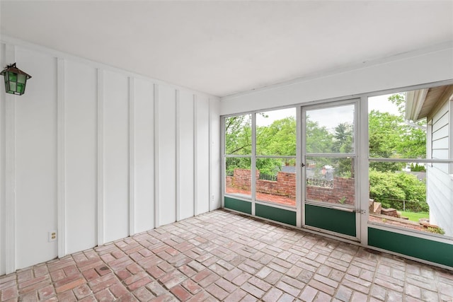 unfurnished sunroom featuring a healthy amount of sunlight