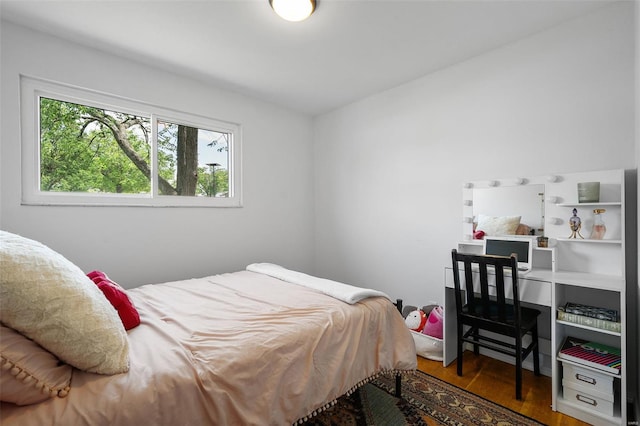 bedroom with wood finished floors