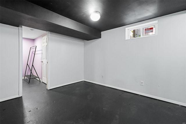 basement featuring baseboards