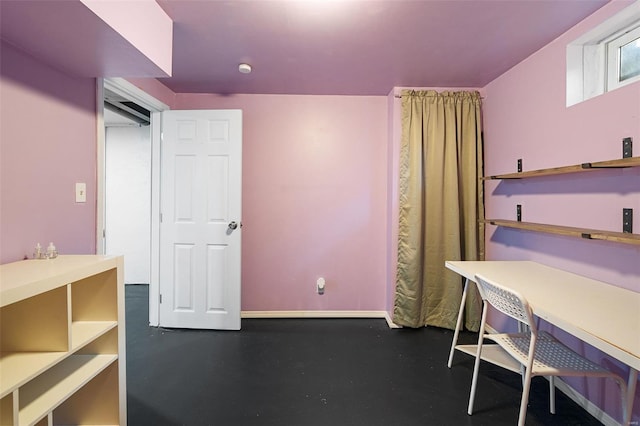 unfurnished office with baseboards