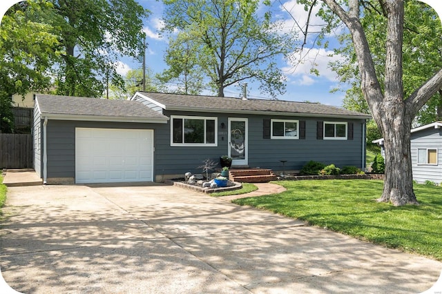ranch-style home with concrete driveway, fence, a front yard, and a garage