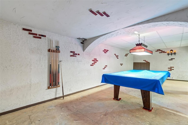 recreation room featuring a textured wall, pool table, a drop ceiling, and baseboards