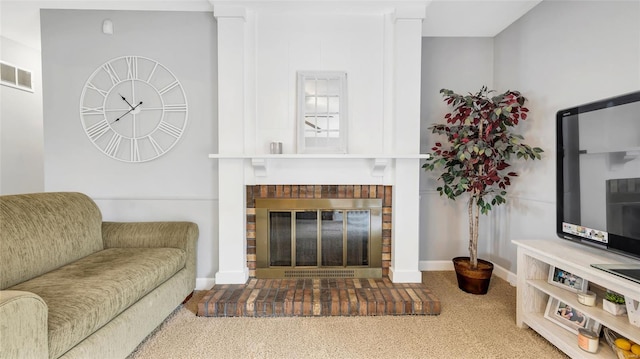 living room featuring a fireplace, carpet, visible vents, and baseboards