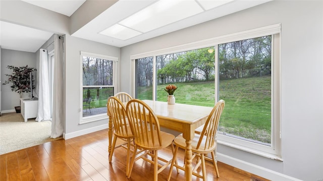 dining area featuring baseboards and wood finished floors
