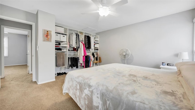 bedroom with baseboards, a closet, a ceiling fan, and carpet floors