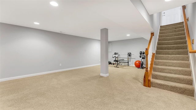 finished basement with carpet floors, baseboards, recessed lighting, and stairs