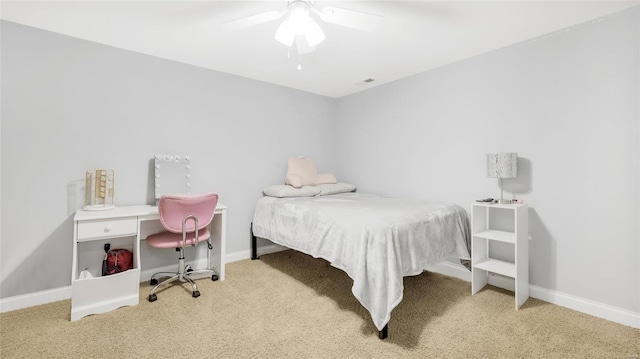 bedroom featuring visible vents, baseboards, a ceiling fan, and carpet floors