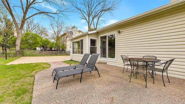 view of patio featuring fence