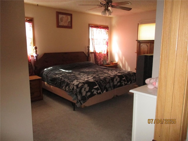 carpeted bedroom with a ceiling fan