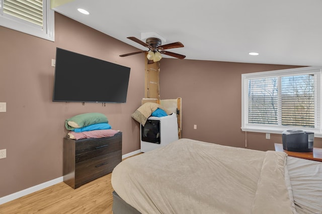 bedroom featuring recessed lighting, baseboards, wood finished floors, and lofted ceiling