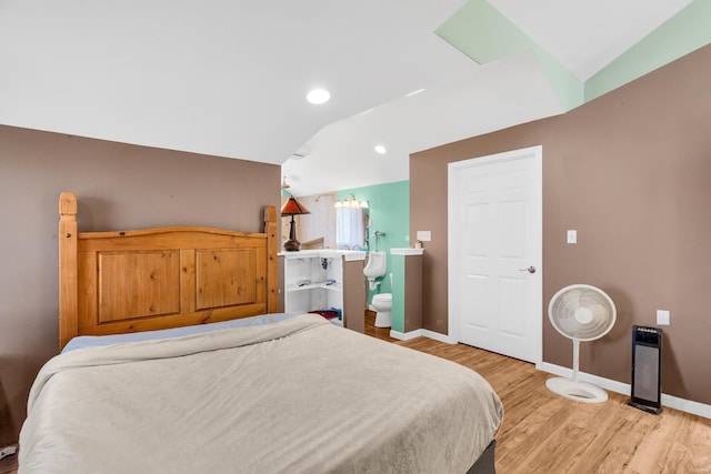 bedroom featuring light wood-type flooring, baseboards, recessed lighting, connected bathroom, and lofted ceiling
