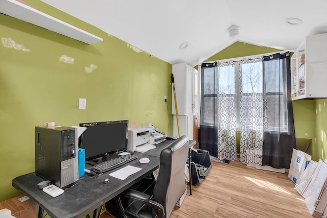 office area featuring wood finished floors and lofted ceiling