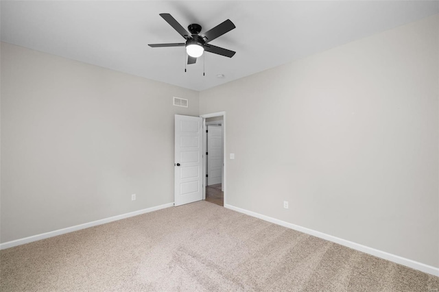 unfurnished room with ceiling fan, baseboards, visible vents, and carpet floors