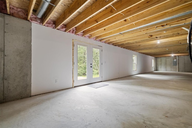 below grade area featuring french doors and electric panel