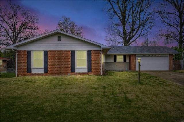 single story home with a front yard, brick siding, driveway, and an attached garage