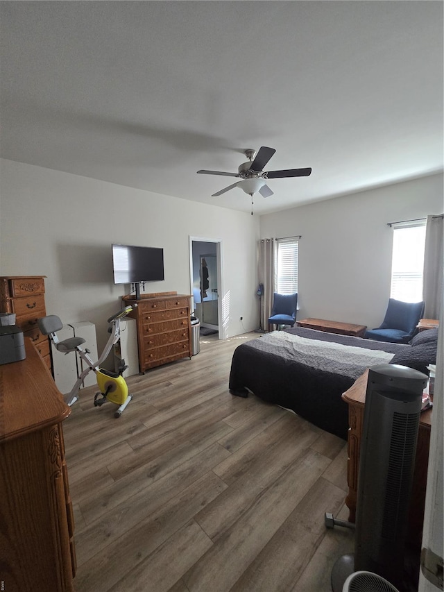 bedroom with wood finished floors and ceiling fan