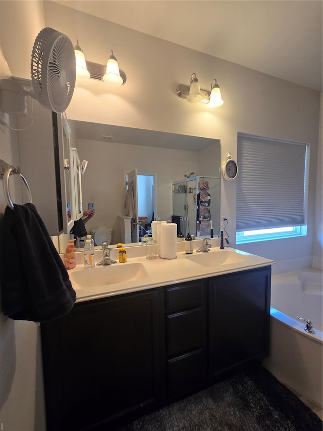 full bathroom with a sink, a bath, double vanity, and a stall shower