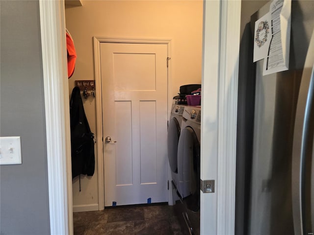 clothes washing area with washer and dryer and laundry area