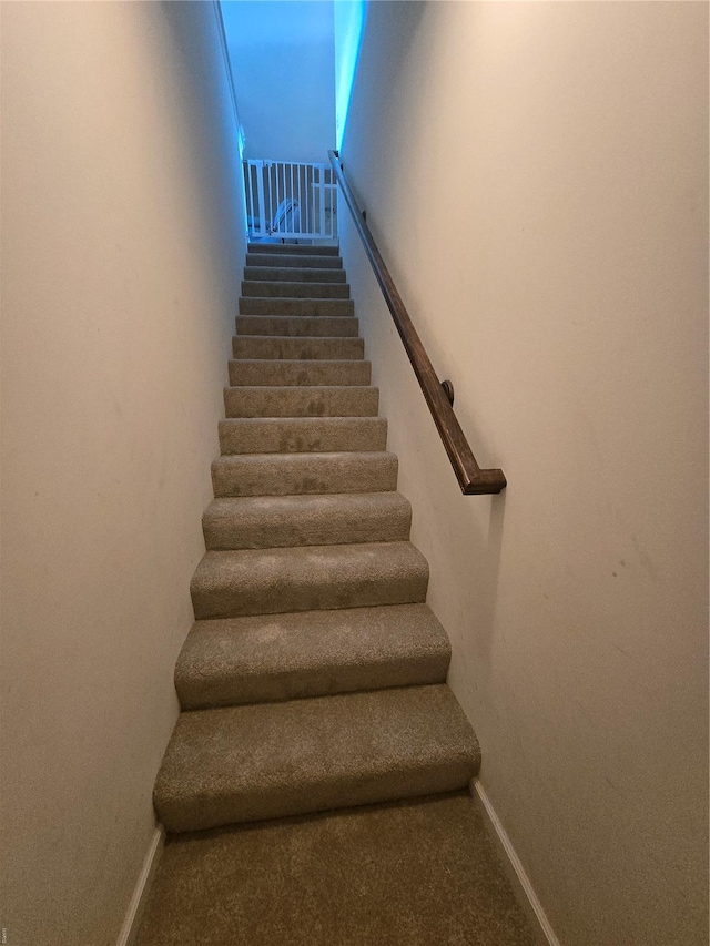 stairs featuring baseboards