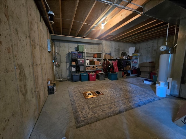 unfinished basement featuring water heater