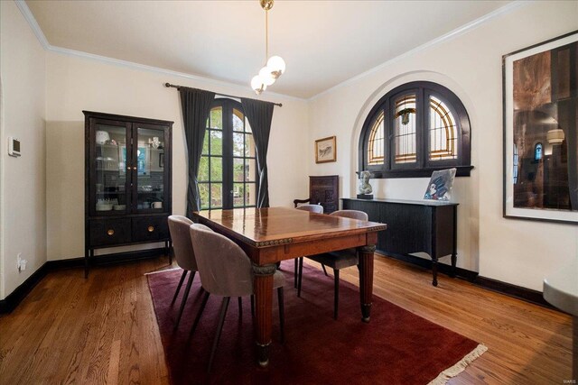 dining room with baseboards, ornamental molding, french doors, and wood finished floors