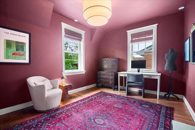 home office featuring baseboards and wood finished floors