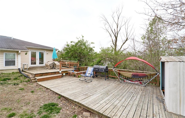deck featuring french doors and area for grilling