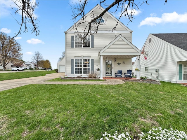rear view of house with a garage and a lawn