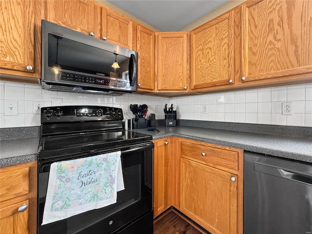 kitchen featuring electric range, stainless steel microwave, dark countertops, and dishwasher