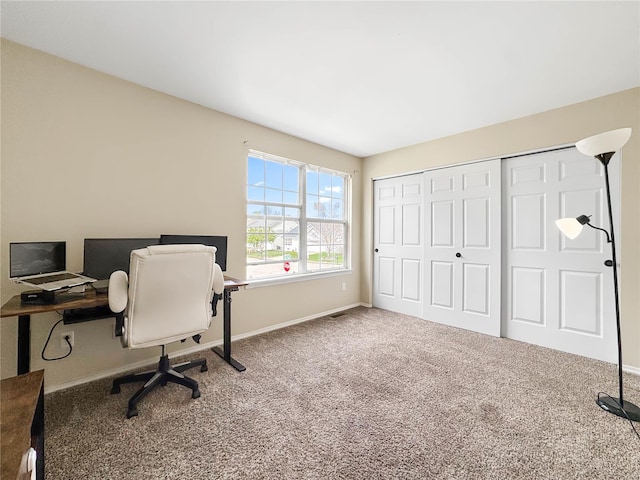 office space with carpet and baseboards