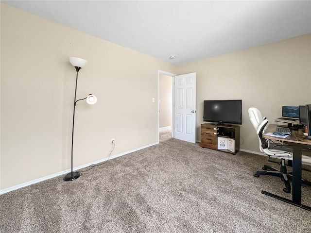 carpeted office space with baseboards