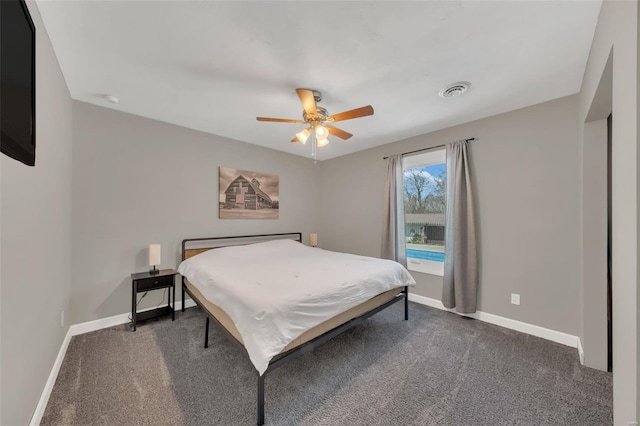 bedroom with dark carpet, baseboards, and ceiling fan