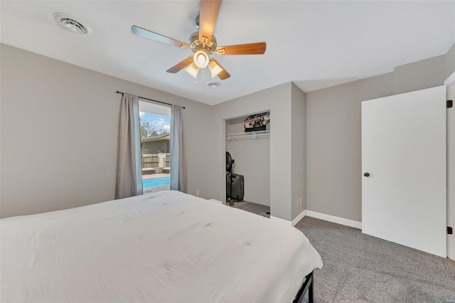 carpeted bedroom with ceiling fan, baseboards, visible vents, and a closet