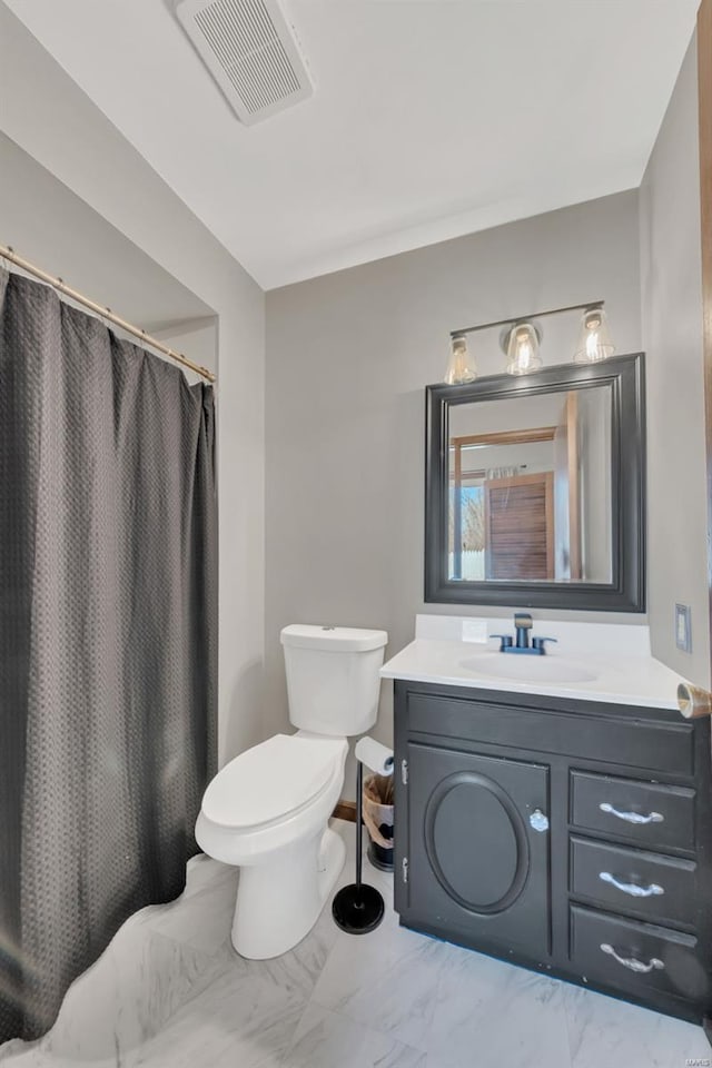 full bathroom featuring visible vents, a shower with curtain, toilet, vanity, and marble finish floor