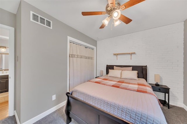 bedroom featuring visible vents, baseboards, a closet, and carpet floors