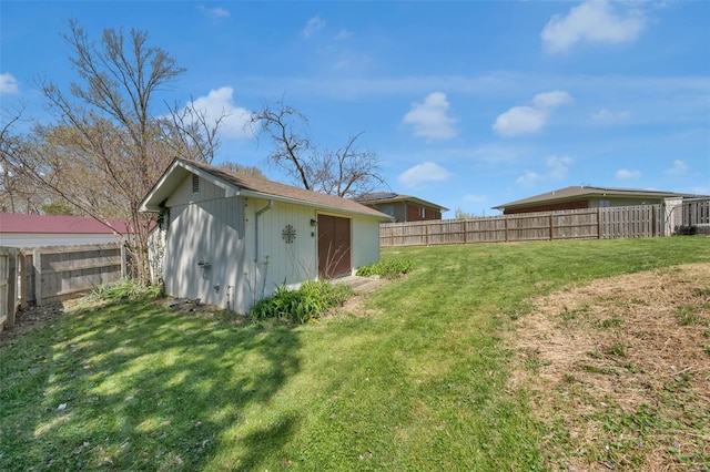 view of shed with a fenced backyard