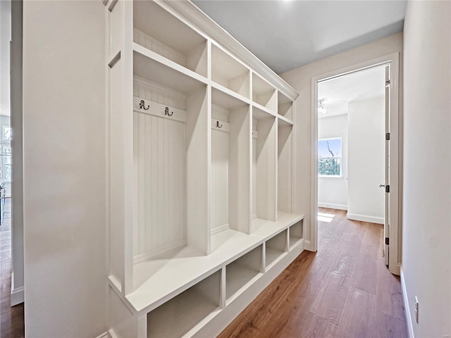 mudroom featuring baseboards and wood finished floors