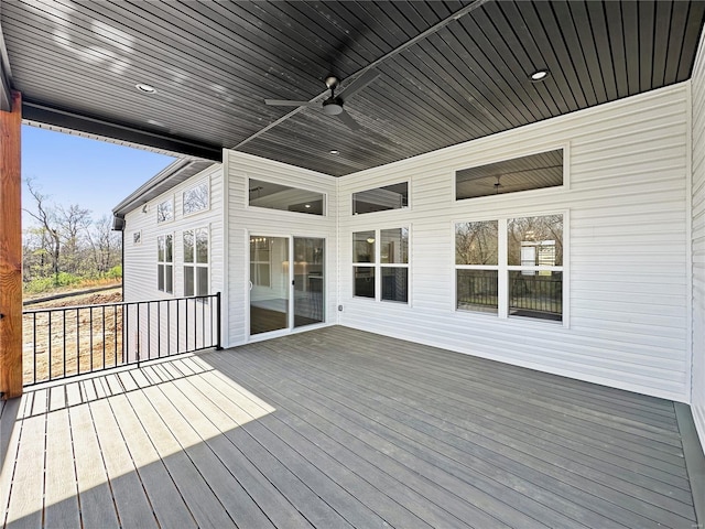 wooden terrace featuring ceiling fan