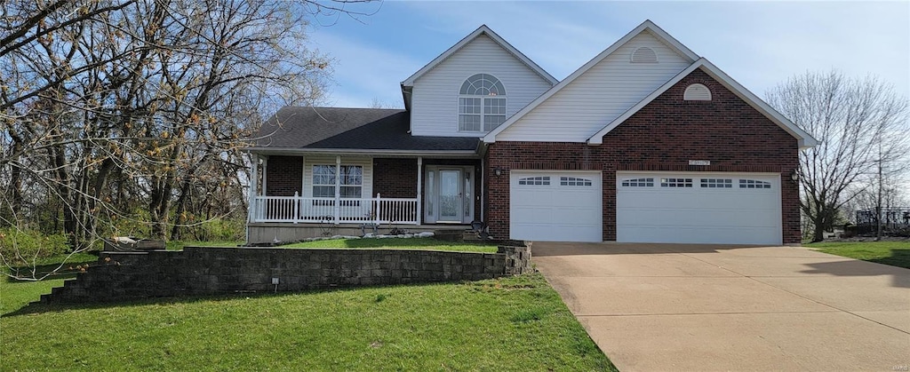 traditional-style house featuring concrete driveway, a front yard, and brick siding
