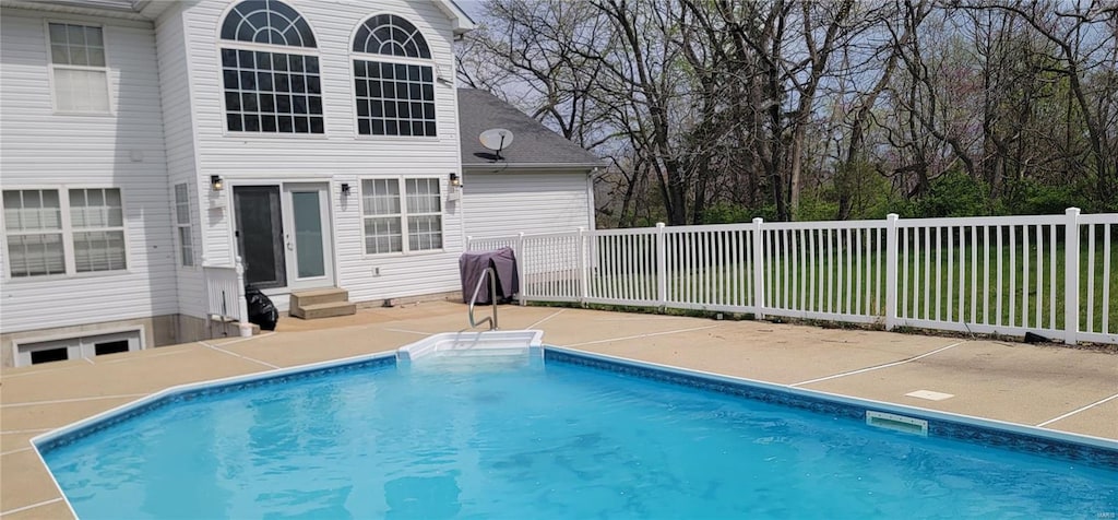 view of pool featuring a fenced in pool, a patio, entry steps, and fence