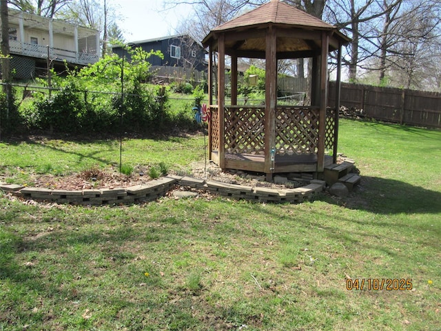 view of yard with a fenced backyard and a gazebo