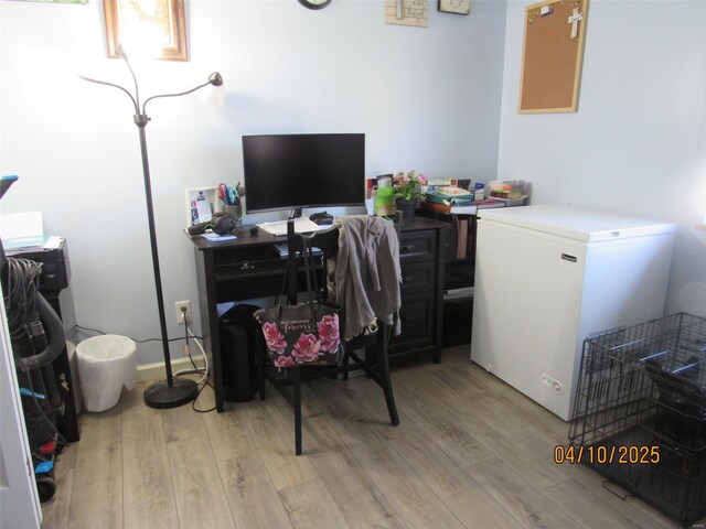home office with wood finished floors