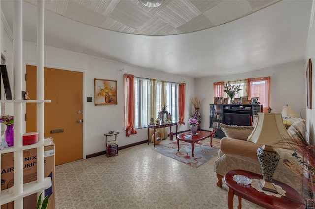living area with a wealth of natural light and baseboards