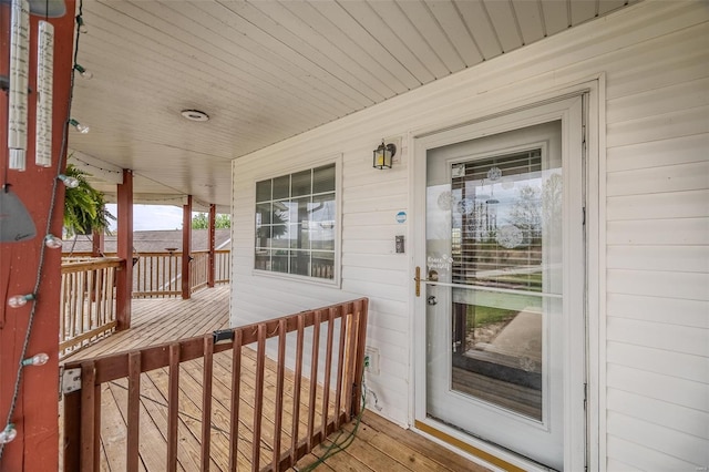 view of exterior entry with covered porch