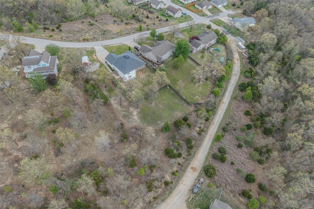 birds eye view of property with a residential view