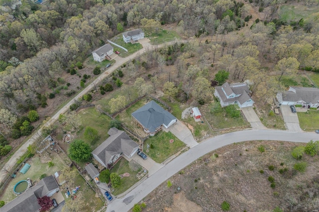 birds eye view of property with a wooded view
