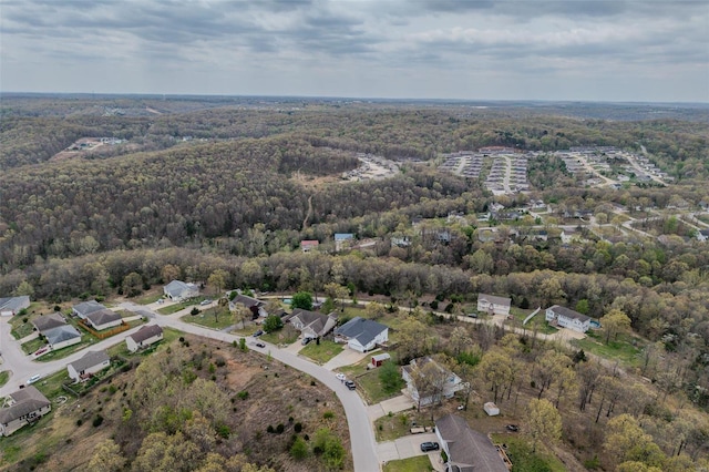 drone / aerial view with a view of trees and a residential view