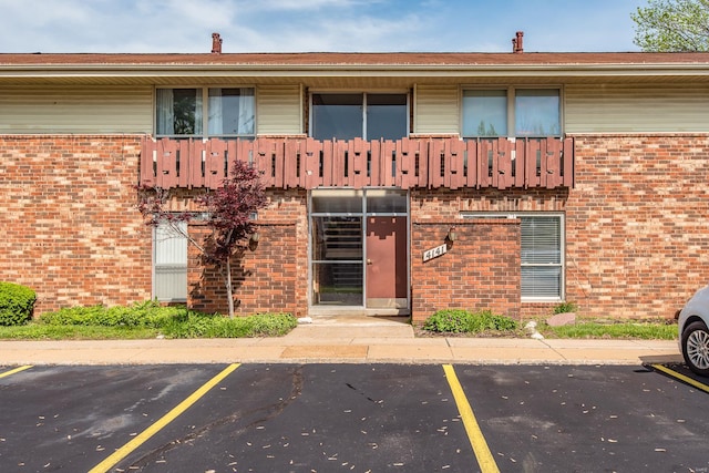 view of property with uncovered parking