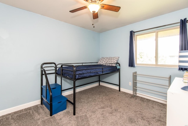 bedroom featuring baseboards, a ceiling fan, and carpet