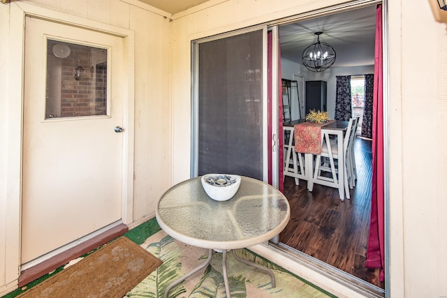 dining room with a notable chandelier and wood finished floors